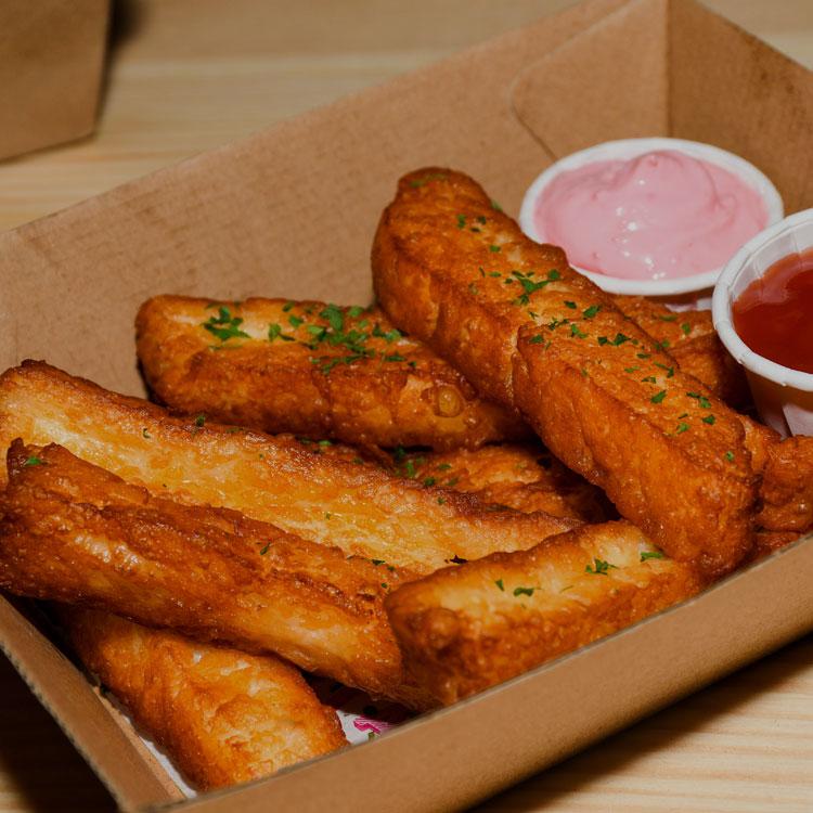 Halloumi fries in a box with dips